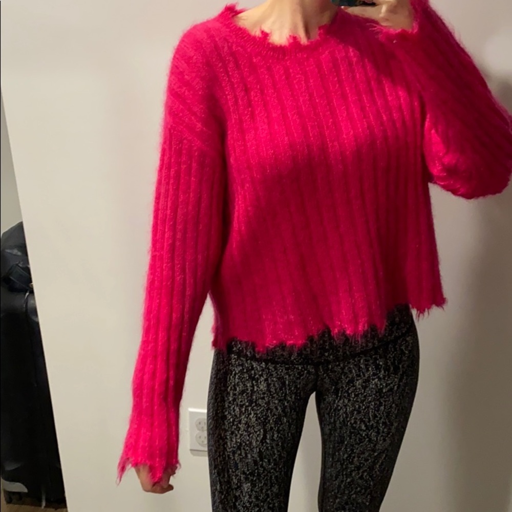 Iro mohair and wool sweater with distressed edges.